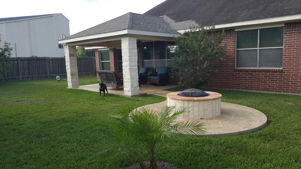 A Fire Pit and Dog in Patio Area