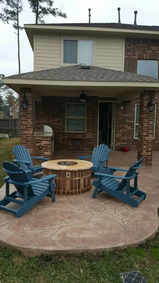 Four Easy Chairs in an Open Setup Outside Home
