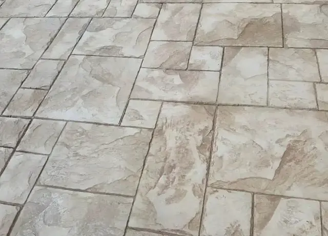 A close up of the floor tiles in a room