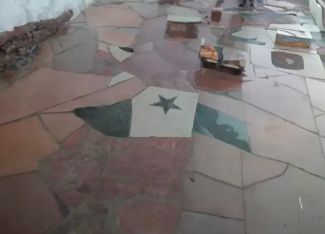 A floor with a star on it and some other things