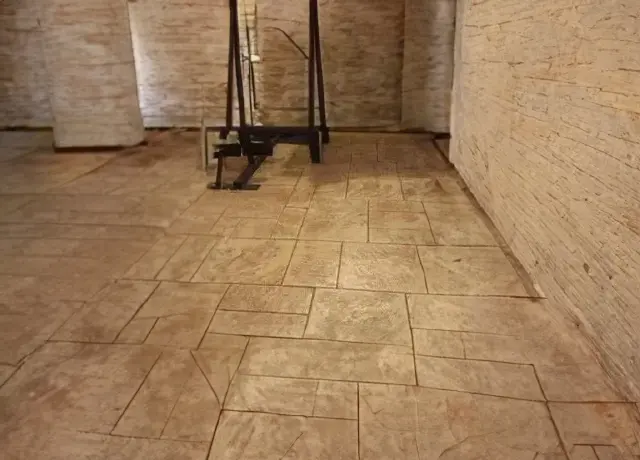 A room with tile floors and walls.