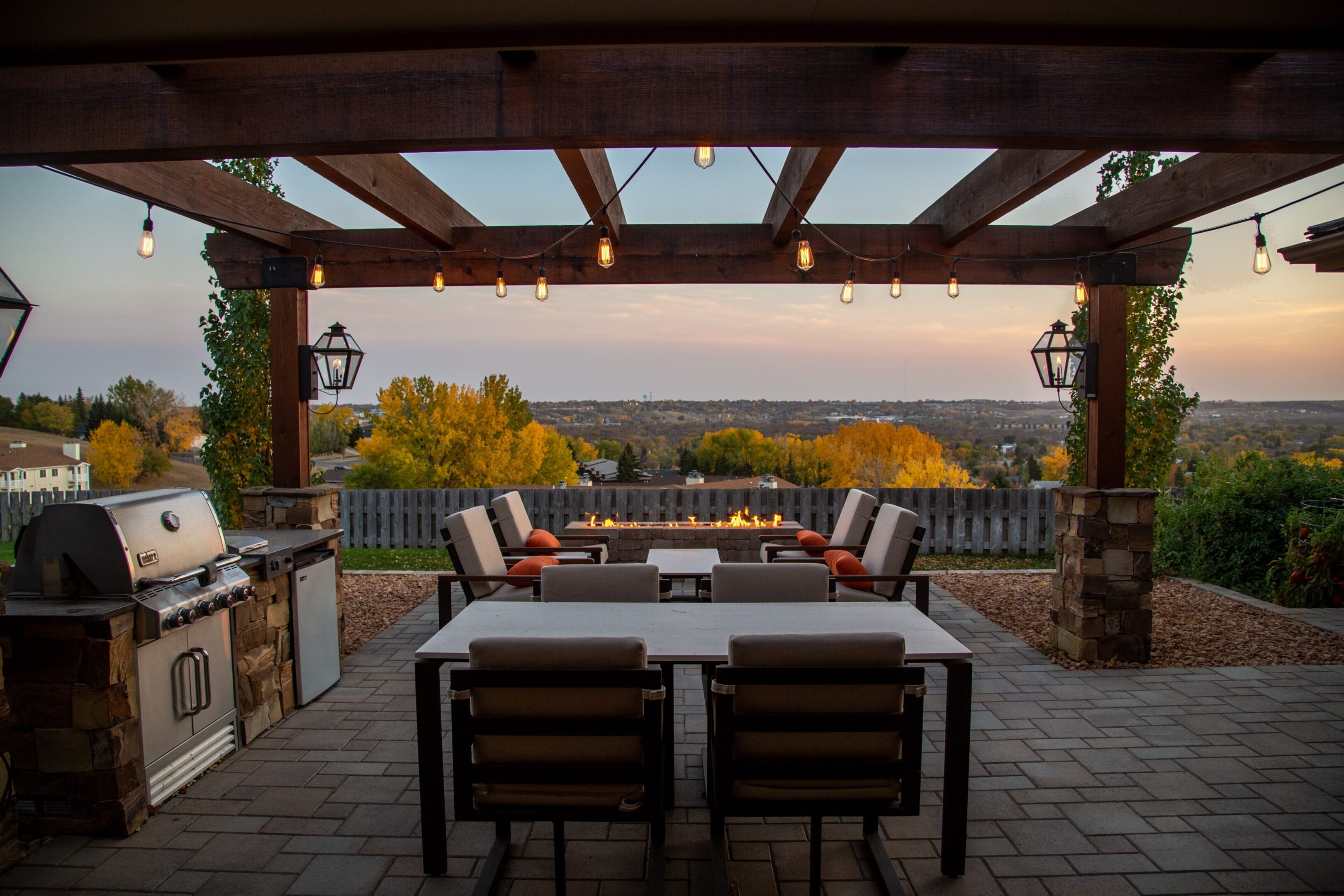 A patio with fire pit and outdoor furniture.