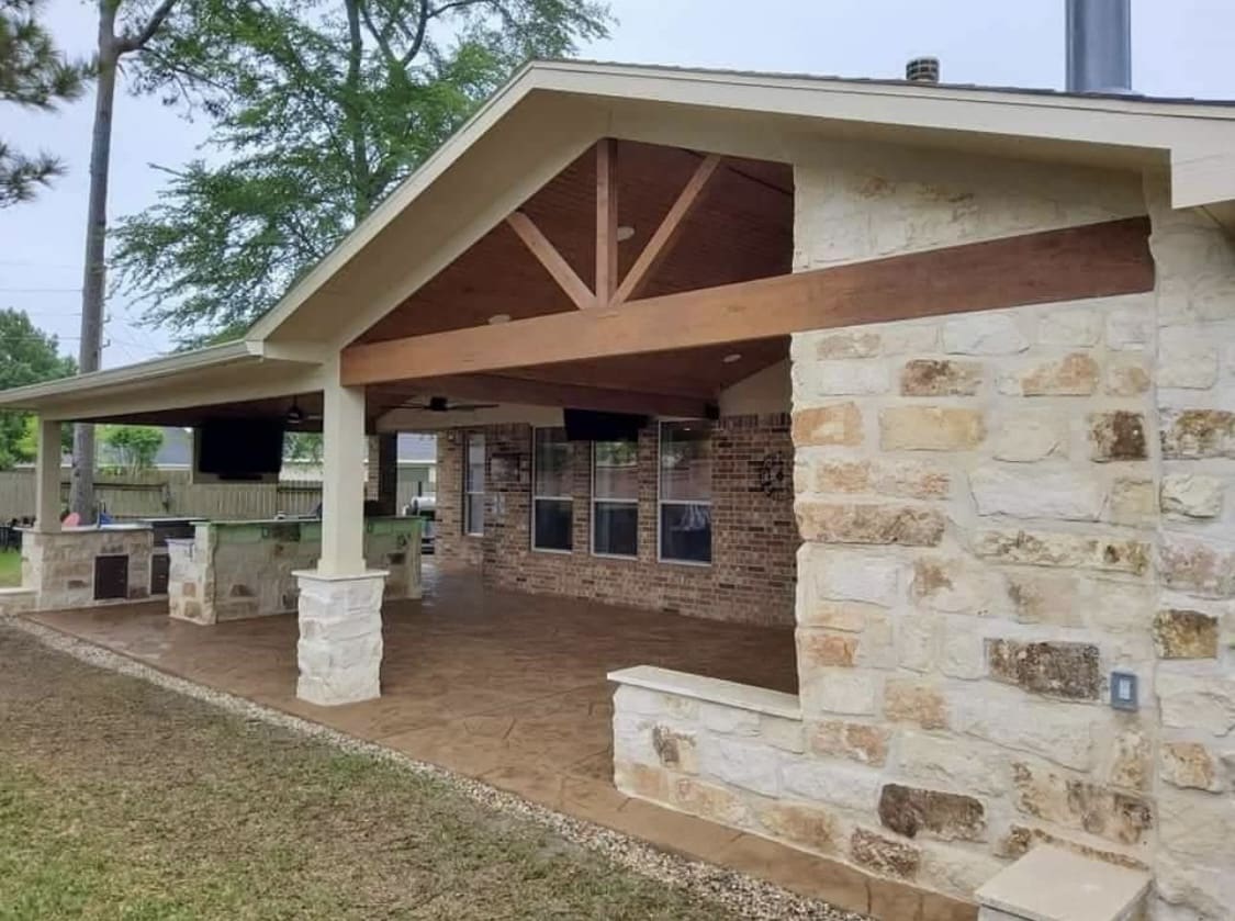 open gable combo patio cover with sports bar and kitchen and corner fireplace